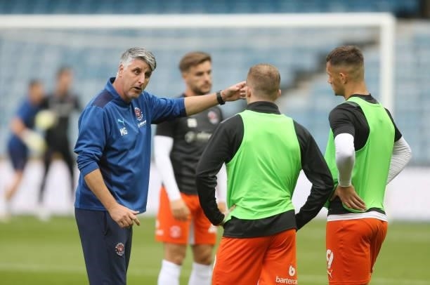 Blackpools assistant manager Mike Garrity gives instructions during the warm-up during the Sky Bet Championship match between Millwall and Blackpool...