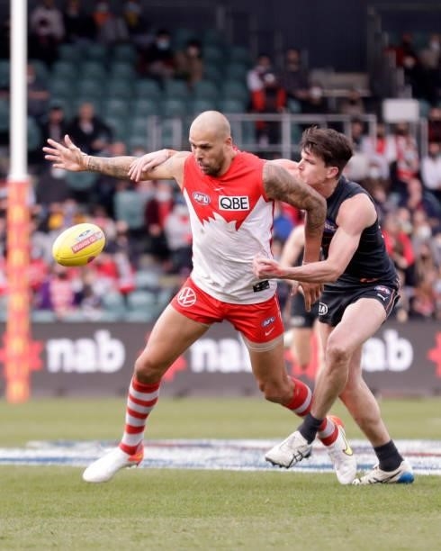 Lance Franklin of the Swans Sam Taylor of the Giants compete for the ball during the 2021 AFL Second Elimination Final match between the Sydney Swans...