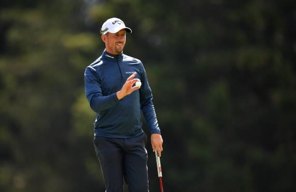 Alexander Bjork of Sweden plays waves at the 16th hole during Day Three of The Omega European Masters at Crans-sur-Sierre Golf Club on August 28,...