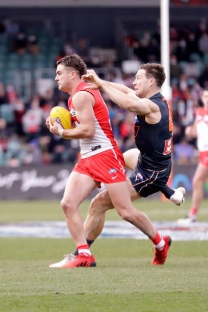 Toby Greene of the Giants collides with Tom Papley of the Swans during the 2021 AFL Second Elimination Final match between the Sydney Swans and the...