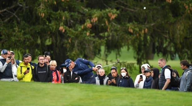 Renato Paratore of Italy plays his second shot at the 17th hole during Day Three of The Omega European Masters at Crans-sur-Sierre Golf Club on...