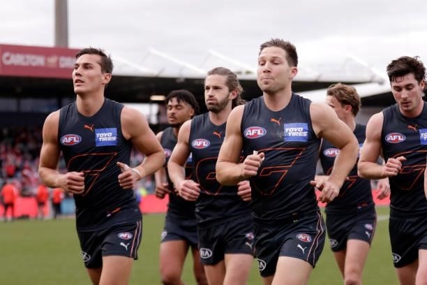 Toby Greene of the Giants leads the team off at half time during the 2021 AFL Second Elimination Final match between the Sydney Swans and the GWS...