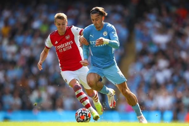 Martin Odegaard of Arsenal and Jack Grealish of Manchester City during the Premier League match between Manchester City and Arsenal at Etihad Stadium...