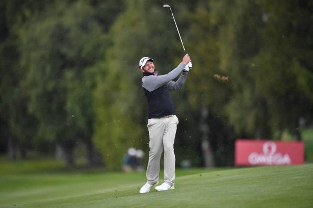 Dean Burmester of Republic of South Africa plays his second shot at the 1st hole during Day Three of The Omega European Masters at Crans-sur-Sierre...