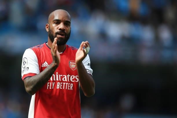 Alexandre Lacazette of Arsenal applauds the fans after the Premier League match between Manchester City and Arsenal at Etihad Stadium on August 28,...