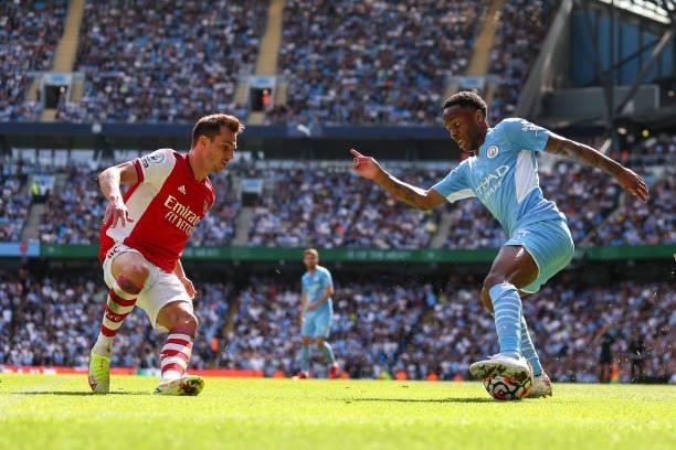 Cedric Soares of Arsenal and Raheem Sterling of Manchester City during the Premier League match between Manchester City and Arsenal at Etihad Stadium...