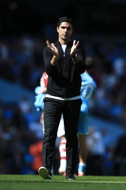 Arsenal manager Mikel Arteta applauds after the Premier League match between Manchester City and Arsenal at Etihad Stadium on August 28, 2021 in...