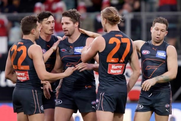 Jesse Hogan of the Giants celebrates a goal with Harry Himmelberg of the Giants and Josh Kelly of the Giants during the 2021 AFL Second Elimination...