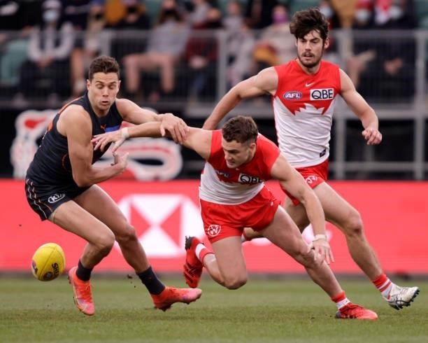Tom Papley of the Swans and Josh Kelly of the Giants compete for the ball during the 2021 AFL Second Elimination Final match between the Sydney Swans...