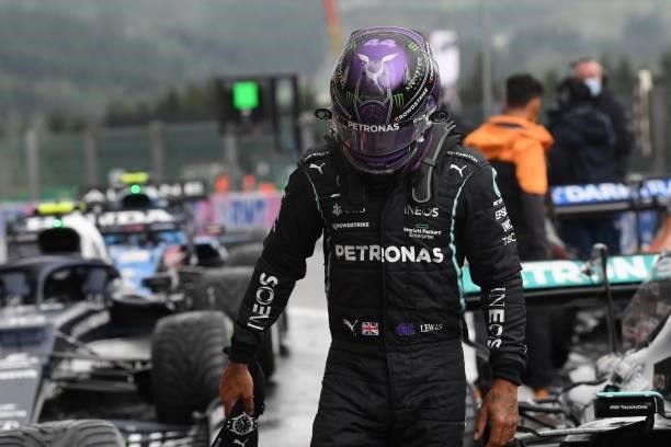 Mercedes' British driver Lewis Hamilton reacts after taking third place in the parc ferme after the qualifying session of the Formula One Belgian...