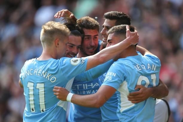 Rodri of Manchester City celebrates with team mates after scoring a goal to make it 4-0 during the Premier League match between Manchester City and...
