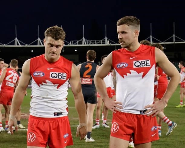Tom Papley of the Swans and Jake Lloyd of the Swans looks dejected after a loss during the 2021 AFL Second Elimination Final match between the Sydney...