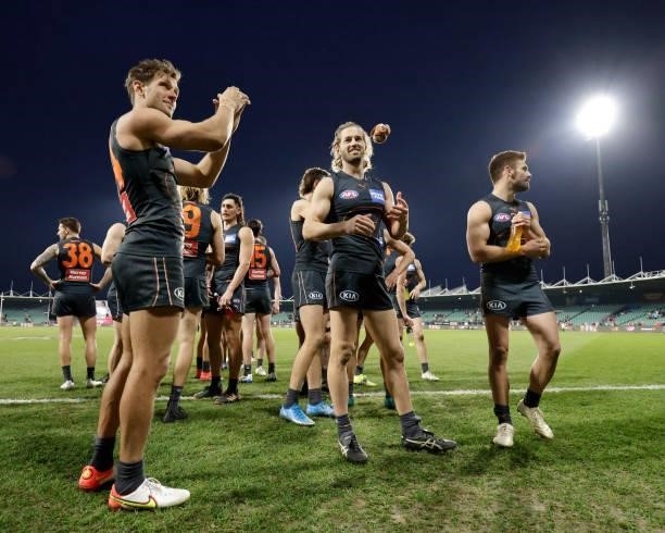 Matt de Boer of the Giants and Callan Ward of the Giants celebrate the win during the 2021 AFL Second Elimination Final match between the Sydney...