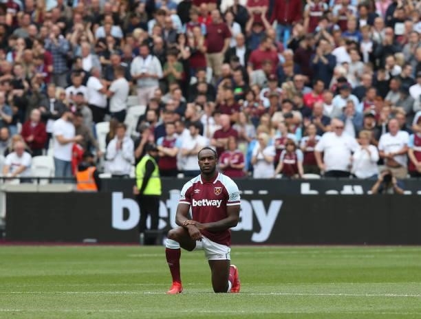 Michail Antonio of West Ham United takes the knee before the Premier League match between West Ham United and Crystal Palace at London Stadium on...