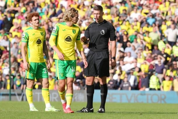 Referee Robbert Jones with Todd Cantwell of Norwich City during the Premier League match between Norwich City and Leicester City at Carrow Road on...