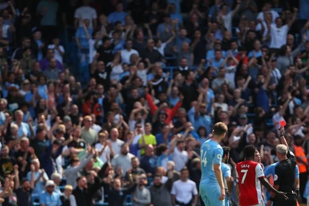Granit Xhaka of Arsenal receives a straight red card during the Premier League match between Manchester City and Arsenal at Etihad Stadium on August...