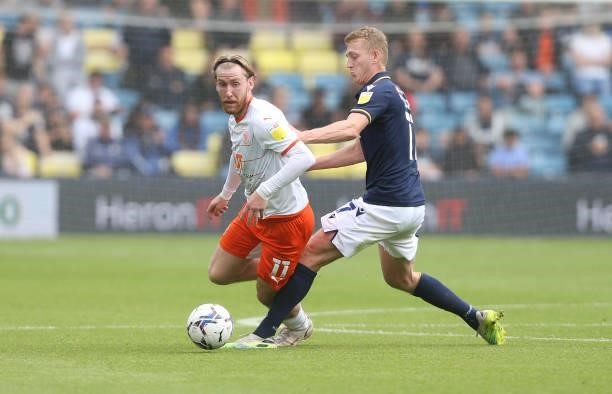 Blackpool's Josh Bowler and Millwall's George Saville during the Sky Bet Championship match between Millwall and Blackpool at The Den on August 28,...