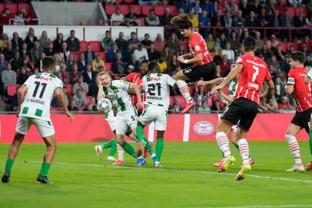 Andre Ramalho of PSV scores the fourth goal to make it 2-2 via Mohamed El Hankouri of FC Groningen during the Dutch Eredivisie match between PSV v FC...