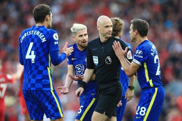 Jorginho of Chelsea and Cesar Azpilicueta of Chelsea argue their point to referee Anthony Taylor during the Premier League match between Liverpool...