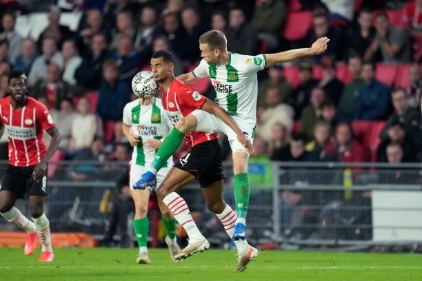 Cody Gakpo of PSV, Mike te Wierik of FC Groningen during the Dutch Eredivisie match between PSV v FC Groningen at the Philips Stadium on August 28,...