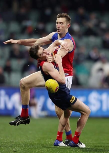 Bayley Fritsch of the Demons and Harris Andrews of the Lions during the 2021 AFL First Qualifying Final match between the Melbourne Demons and the...