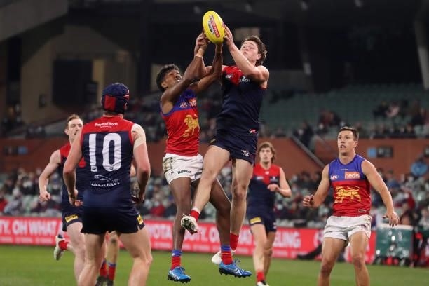 Tom Sparrow of the Demons marks the ball from Keidean Coleman of the Lions during the 2021 AFL First Qualifying Final match between the Melbourne...