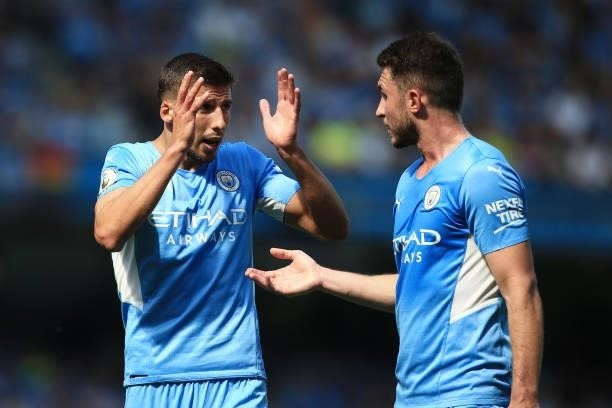 Ruben Dias of Manchester City and Aymeric Laporte of Manchester City talk to each other during the Premier League match between Manchester City and...