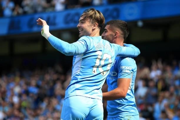 Jack Grealish of Manchester City celebrates with Ferran Torres of Manchester City during the Premier League match between Manchester City and Arsenal...