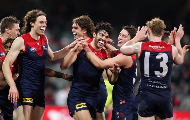 Christian Petracca of the Demons celebrates a goal with team mates during the 2021 AFL First Qualifying Final match between the Melbourne Demons and...