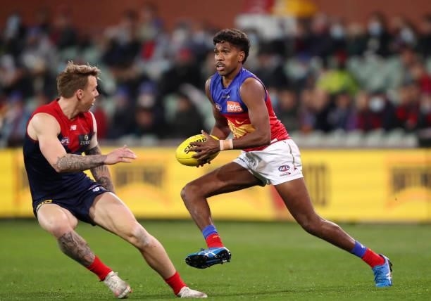 Keidean Coleman of the Lions and James Harmes of the Demons during the 2021 AFL First Qualifying Final match between the Melbourne Demons and the...
