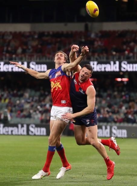 Joe Daniher of the Lions and Steven May of the Demons during the 2021 AFL First Qualifying Final match between the Melbourne Demons and the Brisbane...