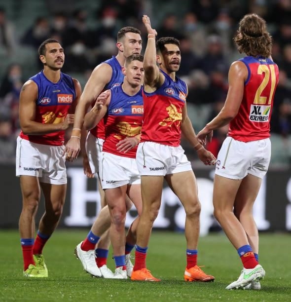Charlie Cameron of the Lions celebrates a goal with Nakia Cockatoo, Dayne Zorko and Tom Fullarton during the 2021 AFL First Qualifying Final match...