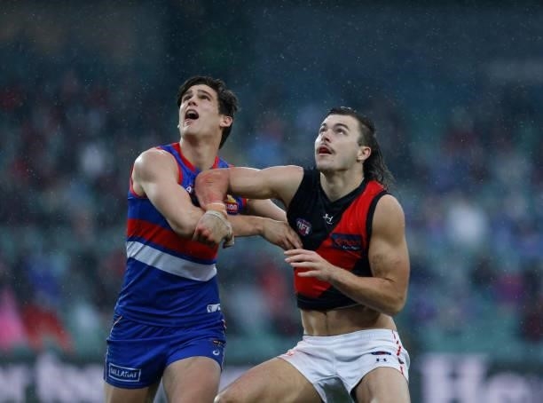 Lewis Young of the Bulldogs and Sam Draper of the Bombers fight for position during the 2021 AFL First Elimination Final match between the Western...