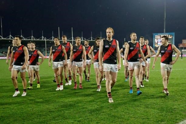 Aaron Francis of the Bombers leads Essendon off the field during the 2021 AFL First Elimination Final match between the Western Bulldogs and the...