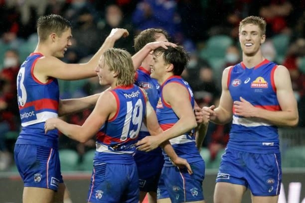 Laitham Vandermeer of the Bulldogs celebrates a goal with Cody Weightman of the Bulldogs during the 2021 AFL First Elimination Final match between...
