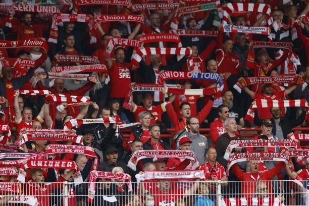 Union's fans cheer during the German first division Bundesliga football match between 1 FC Union Berlin and Borussia Moenchengladbach in Berlin, on...