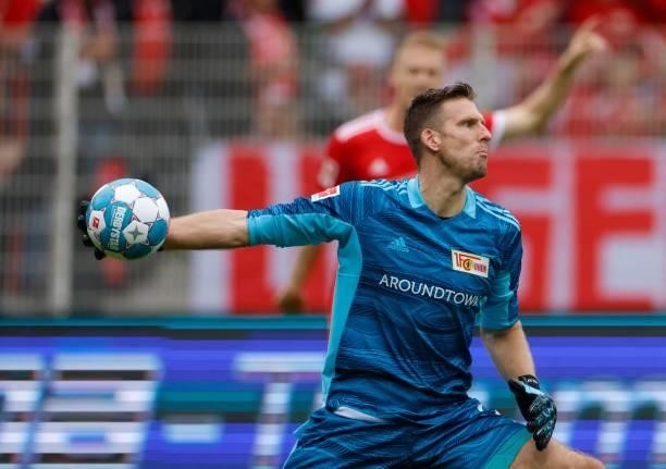 Union Berlin's German goalkeeper Andreas Luthe passes the ball during the German first division Bundesliga football match between 1 FC Union Berlin...