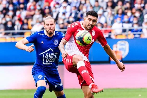 Antonio Barreca of AS Monaco is chased by Renaud Ripart of Troyes during the Ligue 1 Uber Eats match between Troyes and Monaco at Stade de l'Aube on...