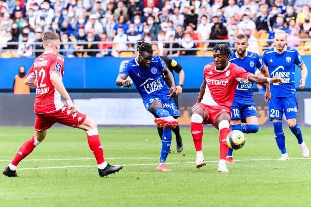 Mama Balde of Troyes attempts a kick while being defended by Axel Disasi of AS Monaco during the Ligue 1 Uber Eats match between Troyes and Monaco at...