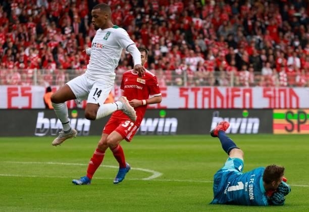 Union Berlin's German goalkeeper Andreas Luthe makes a save during the German first division Bundesliga football match between 1 FC Union Berlin and...