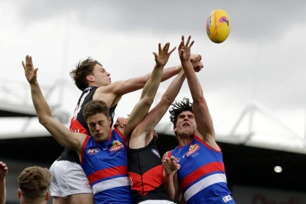 Jordan Ridley of the Bombers spoils the mark during the 2021 AFL First Elimination Final match between the Western Bulldogs and the Essendon Bombers...