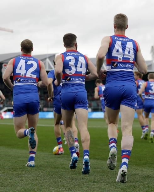 Alex Keath of the Bulldogs, Bailey Williams of the Bulldogs and Tim English of the Bulldogs come out onto the field during the 2021 AFL First...