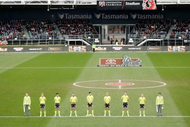 The Umpires line up for the National Anthem during the 2021 AFL First Elimination Final match between the Western Bulldogs and the Essendon Bombers...