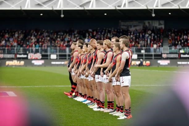 The Essendon Bombers line up for the National Anthem during the 2021 AFL First Elimination Final match between the Western Bulldogs and the Essendon...