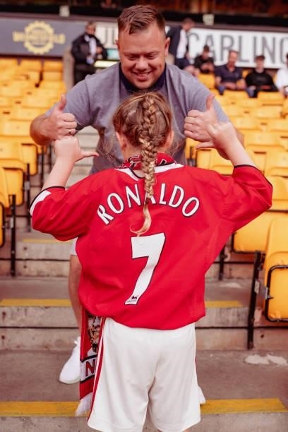 Fan of Manchester United shows off her Cristiano Ronaldo shirt prior to the Premier League match between Wolverhampton Wanderers and Manchester...