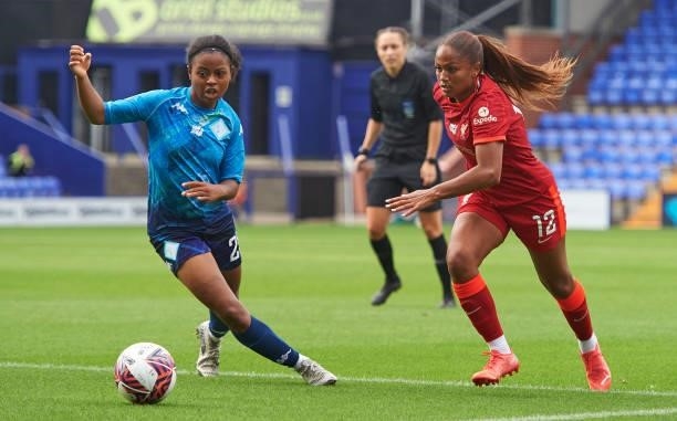 Taylor Hinds of Liverpool FC Women and Kenni Thompson of London City Lionesses in action at Prenton Park on August 29, 2021 in Birkenhead, England.