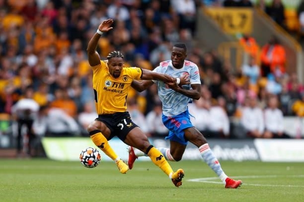 Adama Traore of Wolverhampton Wanderers and Aaron Wan-Bissaka of Manchester United during the Premier League match between Wolverhampton Wanderers...