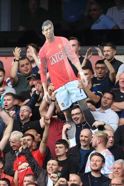 Manchester United fans pass around a cardboard cut-out of Cristiano Ronaldo during the Premier League match between Wolverhampton Wanderers and...
