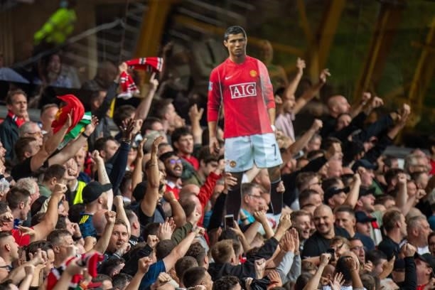 Manchester United fans holding picture of Cristiano Ronaldo during the Premier League match between Wolverhampton Wanderers and Manchester United at...