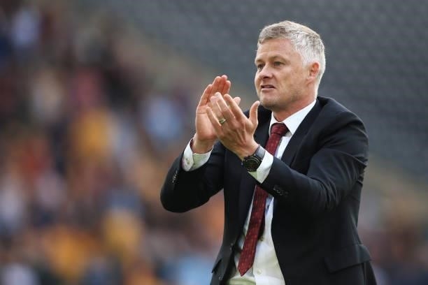 Manchester United manager Ole Gunnar Solskjaer celebrates victory after the Premier League match between Wolverhampton Wanderers and Manchester...